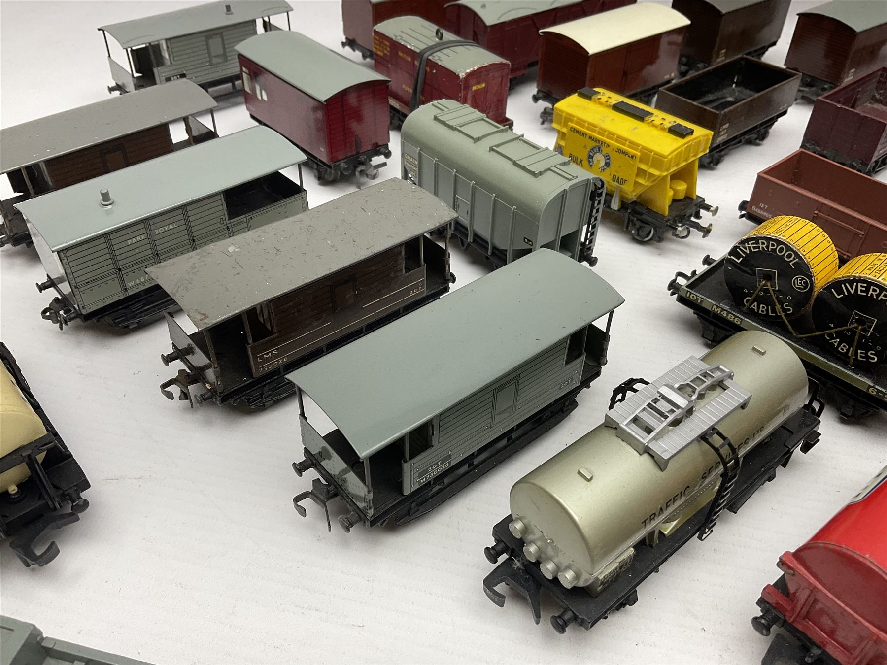 Hornby Dublo - forty-three goods wagons including nine tank wagons (Esso, Mobil, Vacuum, UD and Traffic Services), brake vans, meat and fish wagons, bogie well and bolsters, cable drums, open wagons, salt and grain wagons, etc; and six others by Tri-ang etc; all unboxed (49)