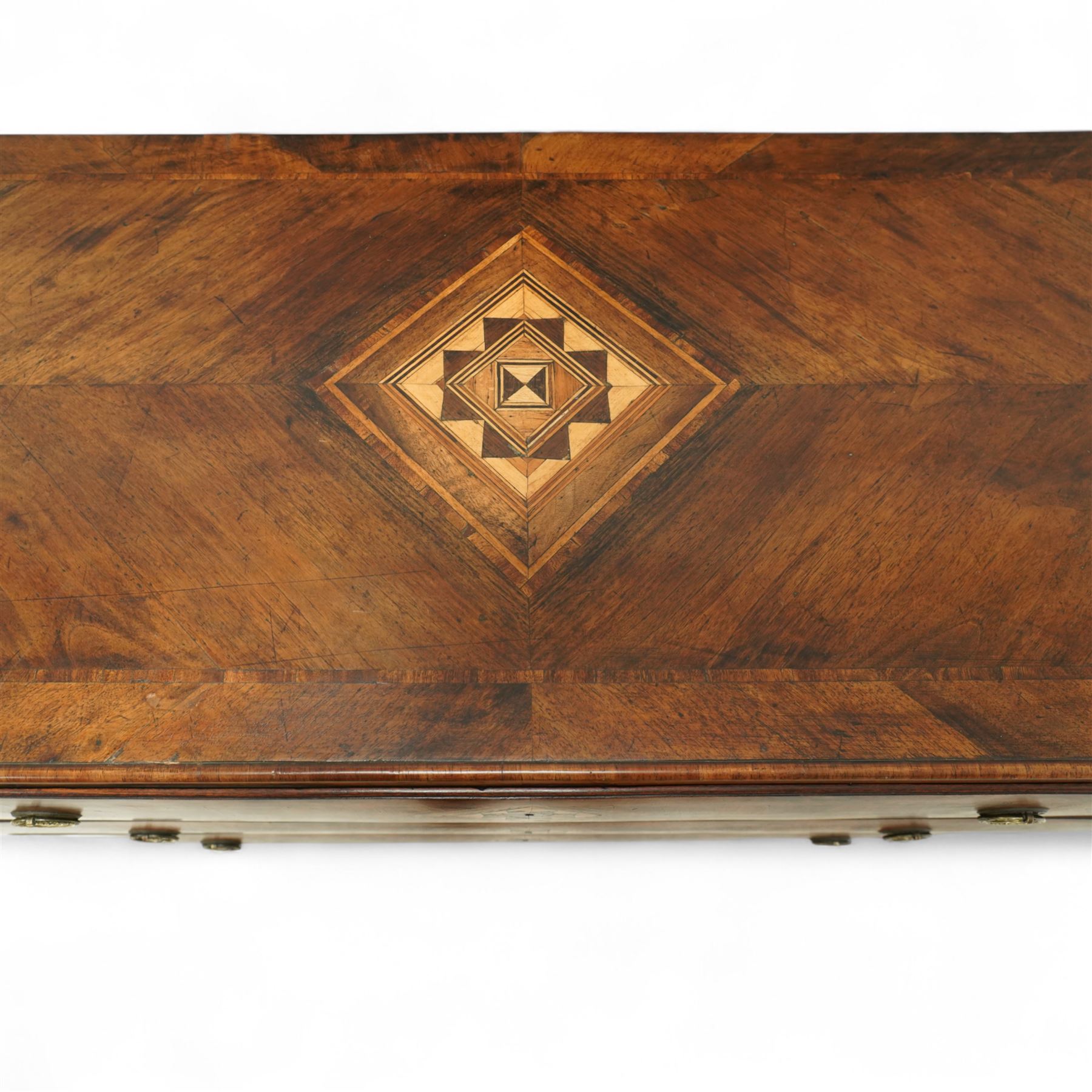 Large 18th-century North Italian walnut commode, rectangular top with quartered veneer, central parquetry inlay and raised moulded edges above three drawers with brass ring handles, cross banding and further central parquetry inlay, supported on square tapered feet
