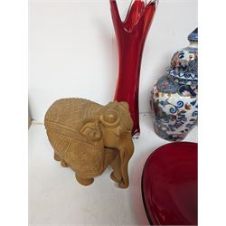 Makkum urn, collection of red art glass including large bowl and a carved wooden elephant, etc