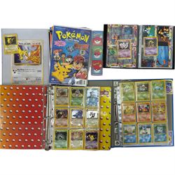 Collection of approximately 400 Pokemon trading cards, mostly 1999 Wizards Pokemon cards to include 1st Edition Dark Gyarados holo 8/82, Dark Charizard 4/82 holo and 21/82 non holo, Dark Blastoise 3/82 holo and 20/82 non holo, Dark Raichu holo 83/82, Dark Dragonite 22/82, eleven first edition cards, Japanese cards, Trainer cards, etc, together with an album of Pokemon the First Movie cards, a voice actor signed copy of Pokemon: The First Movie Animation Comics Mewtwo Strikes Back #1, 5305/8000 with certificate of authenticity with comics 2, 3 and 4 