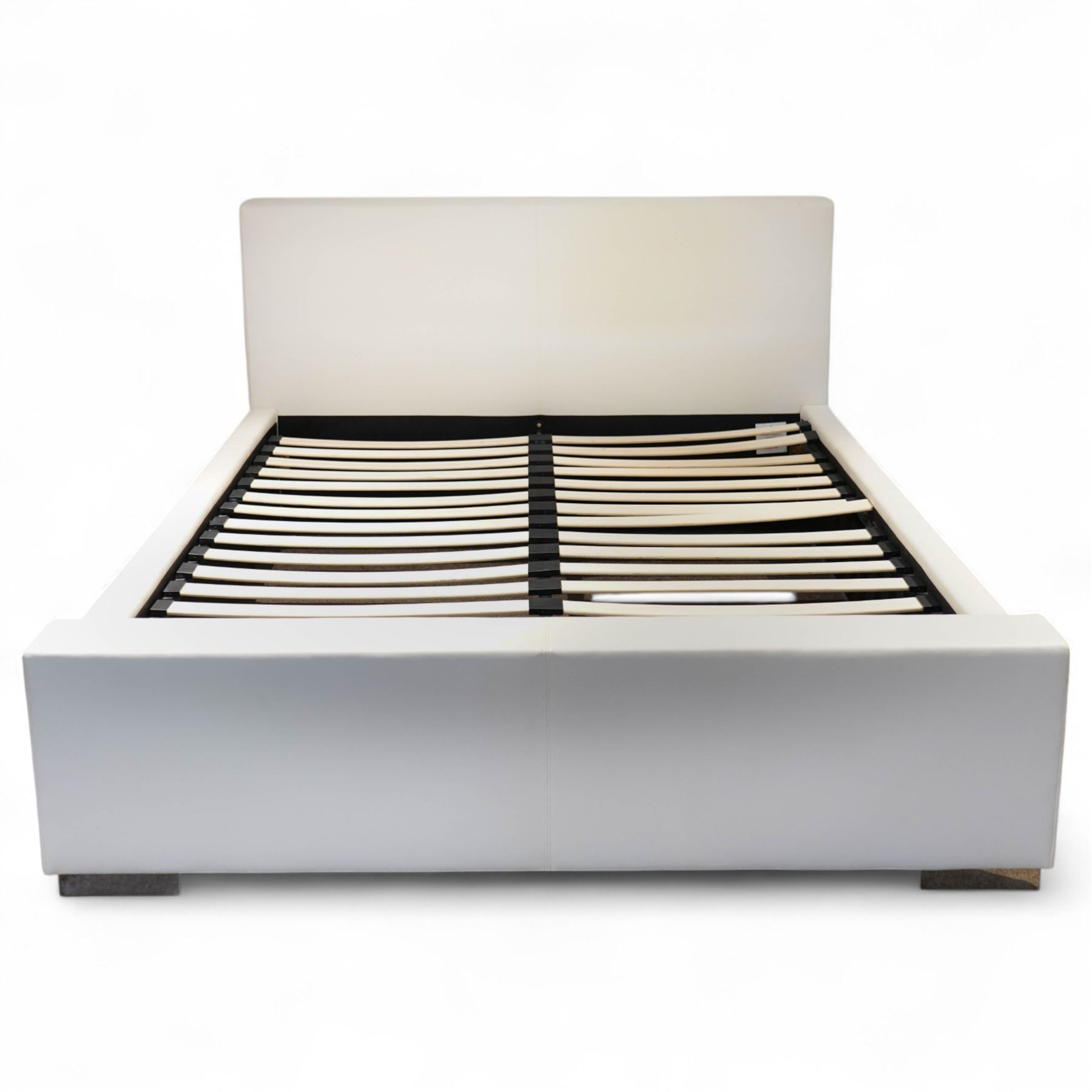 Contemporary upholstered double size bed frame, plain rectangular headboard and footboard upholstered in cream faux leather, sprung beech slatted base raised on concealed feet