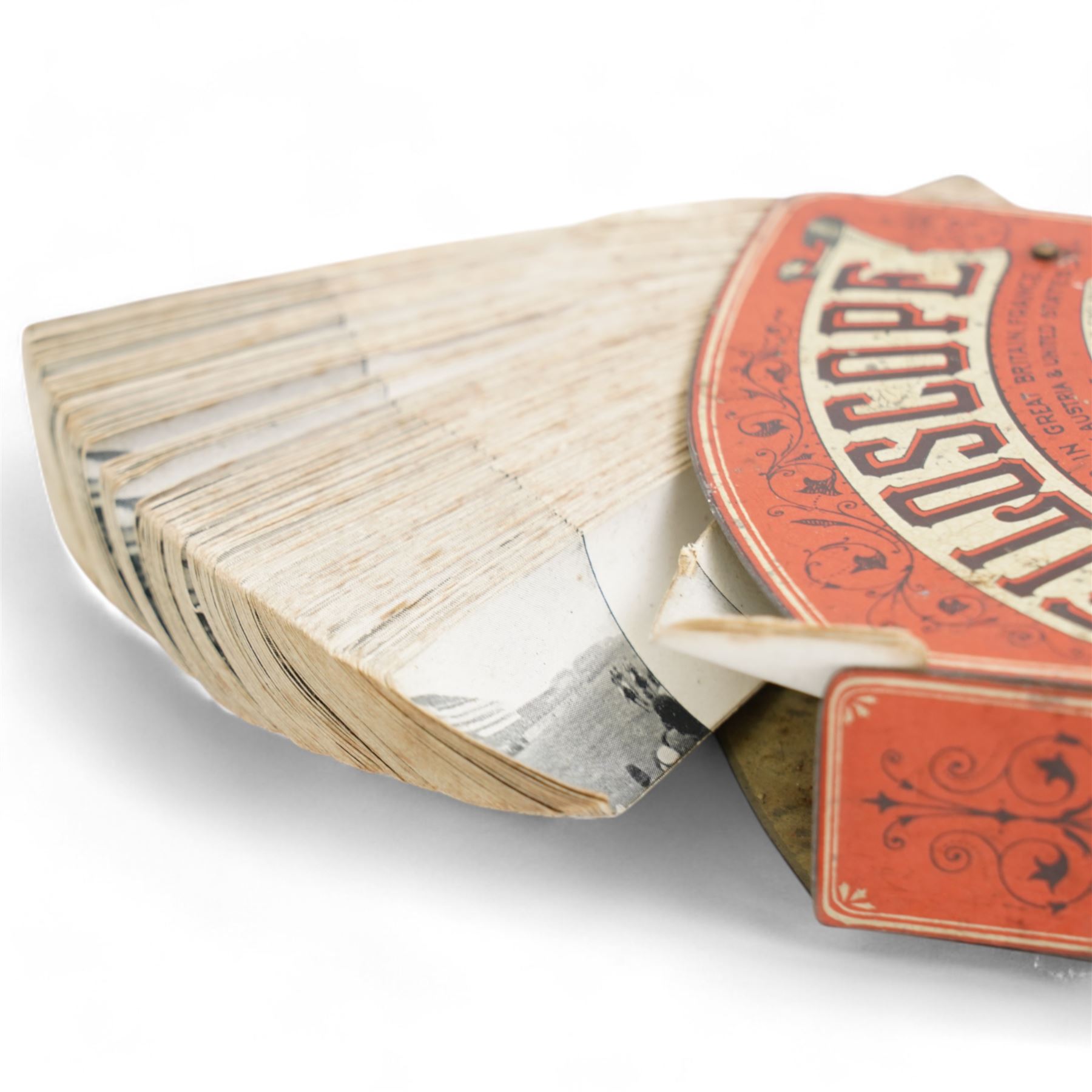 'The Filoscope' flipbook optical toy by The British Mutoscope and Biograph Co. Ltd. comprising a series of images of a horse race and another of two dancers 'Sisters Hengler', red and black litho printed case with lever operation (2)