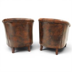 Pair of brown leather tub chairs, with downswept arms with brass studded trim, fixed cushion seat, raised on square tapering supports 