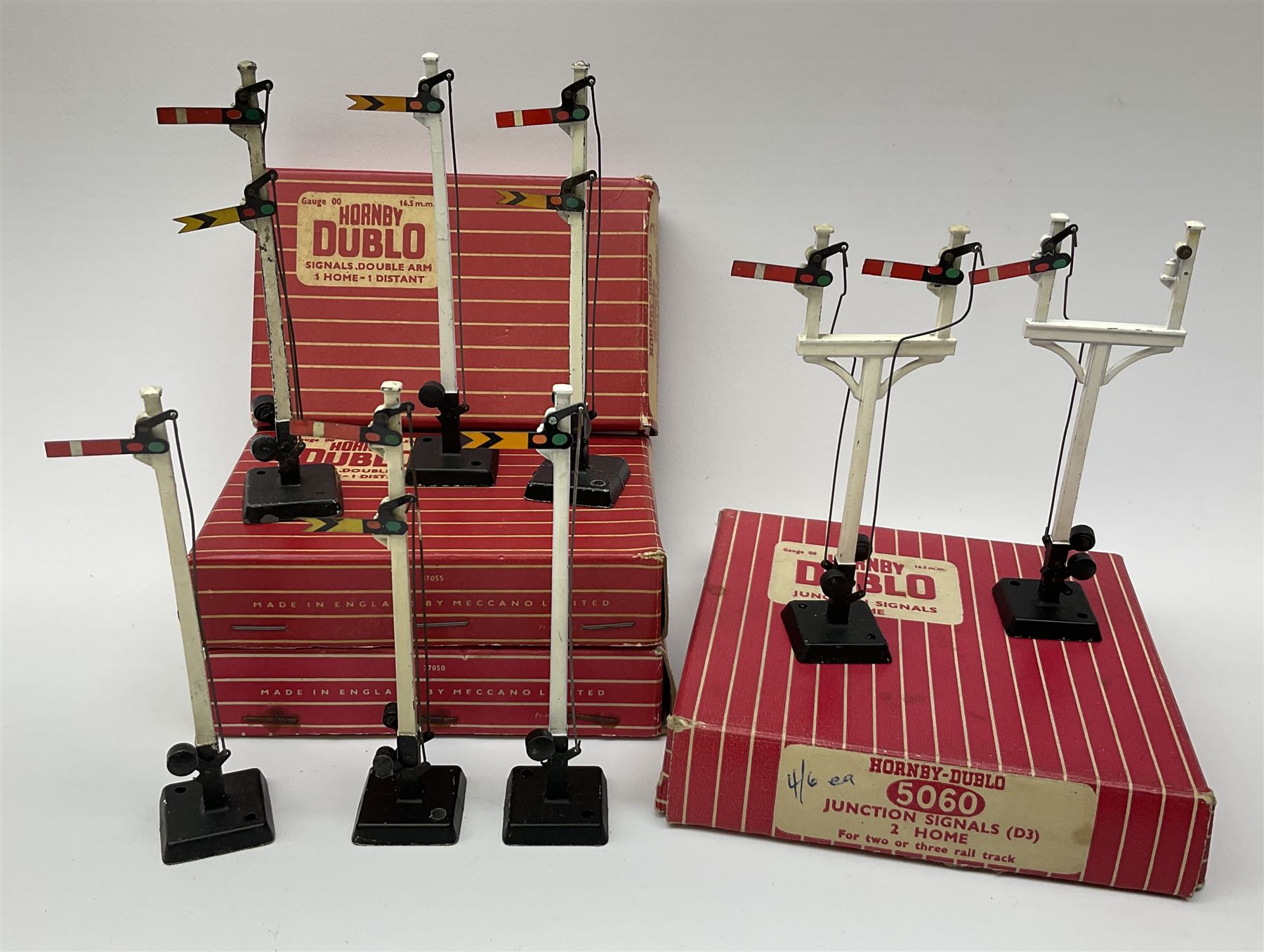 Hornby Dublo - twelve manually operated semaphore signals comprising one 5050 Signals Single Arm (D1) 2 Home, one 5060 Junction Signals (D3) 2 Home; D3 Junction Signal Upper Quadrant (1 Home 1 Distant); two 5055 Signals Double Arm (D2) 1 Home 1 Distant; two D2 Signals Double Arm (Upper Quadrant); three D2 Signals Double Arm Upper Quadrant Home - Distant; and two D1 Signals Single Arm Upper Quadrant; all boxed (12)