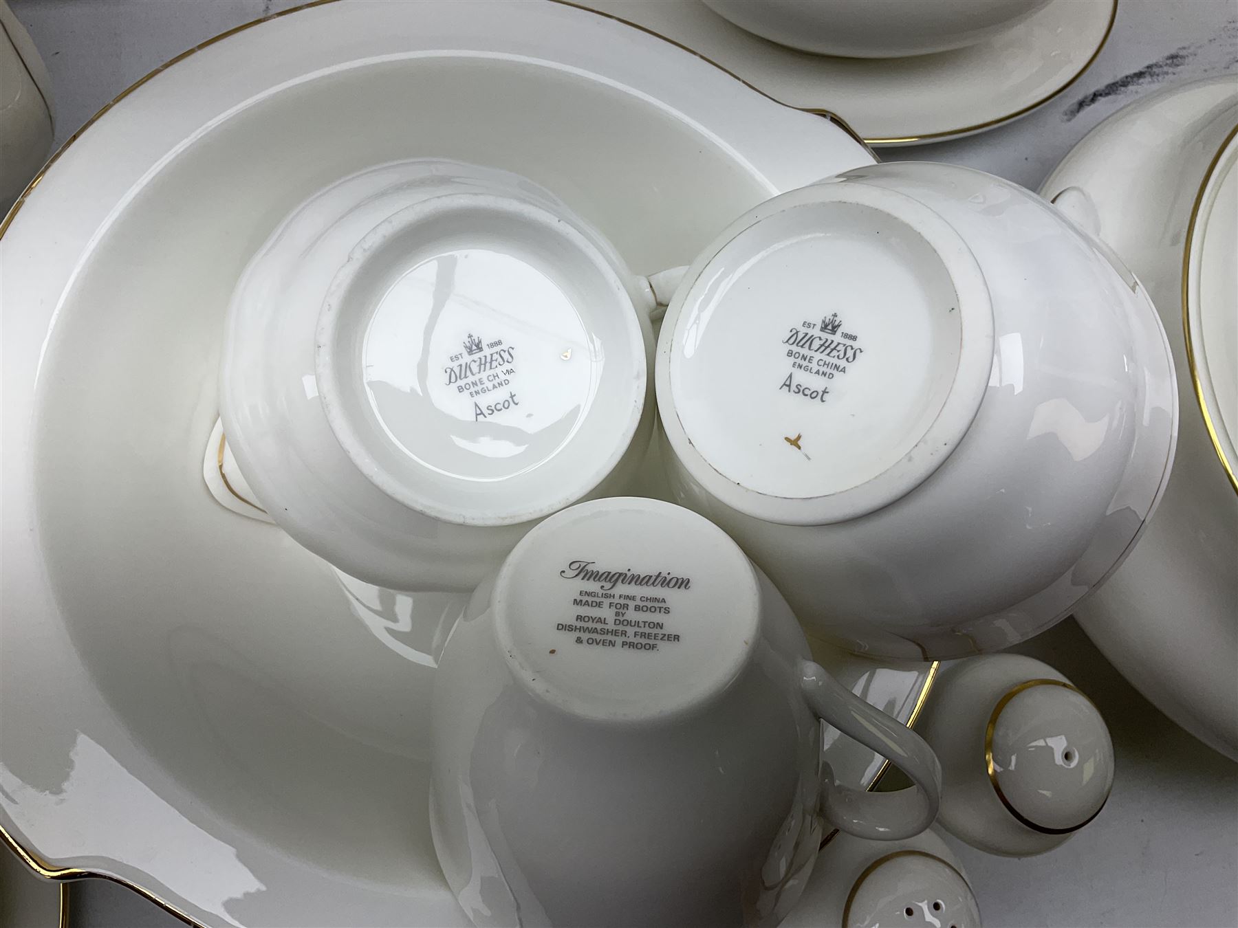 Royal Doulton Imagination pattern part dinner service, comprising eight dinner plates, eight side plates, eight dessert plates, eight bowls and nine cups and saucers, together with Royal Doulton Fortune pattern, five covered tureens,  jug and stand and other similar