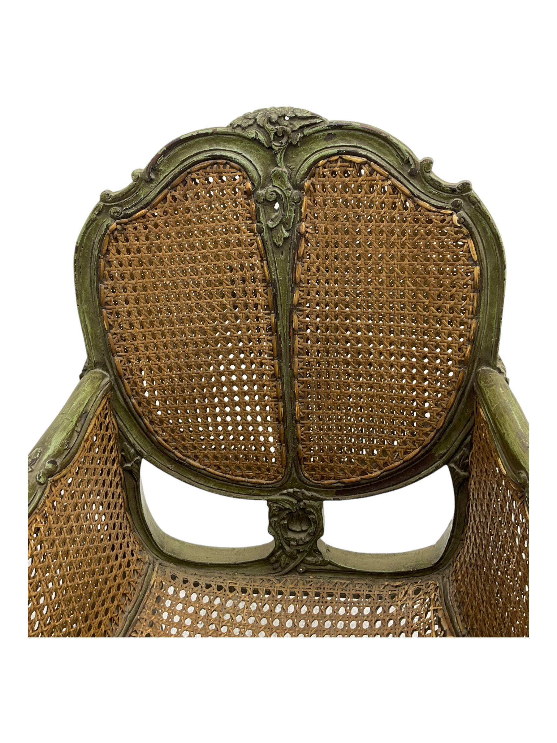 19th century French Louis XV-design armchair, carved and painted wood frame, caned back and seat with scrolled arms, supported by cabriole supports with acanthus leaf decoration