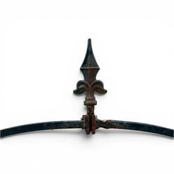Antique wrought iron strapwork garden arch, with scroll form arched top with spearhead finials, over integral side trellis panels, in distressed black-painted finish