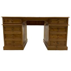 Waxed pine twin pedestal partners desk, fitted with eight drawers