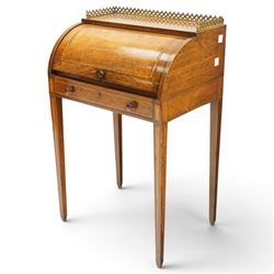 Regency period inlaid mahogany Ladies cylinder writing desk, the rectangular satinwood banded top with raised pierced brass three-quarter gallery, over a cylindrical roll-top enclosing a satinwood fitted interior with pigeonholes, correspondence drawers, ink wells and a sliding hinged writing slope, the base fitted with single frieze drawer, raised on square tapering supports
Provenance: Kirkham Hall