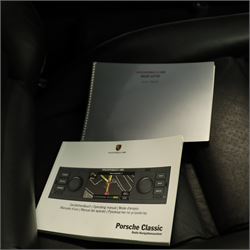 1991 Porsche 928 S4 Automatic Coupé

Registration: L644 LBE
Date of first registration as shown on V5: 1 July 1994
Porsche year of manufacture: 1991
Engine: 5.0-litre V8 petrol
Transmission: Automatic
Odometer reading: 37,886 kilometres (approximately 23,541 miles)
Colour: Slate Grey metallic
Interior: Black leather
V5C: Present
Keys: One
Chassis number: WP0ZZZ92ZMS800460

An exceptional Porsche 928 S4 Automatic Coupé finished in Slate Grey metallic with a black leather interior. The car displays a notably low odometer reading of just 37,886 kilometres, equivalent to approximately 23,541 miles.

The 928 S4 combined Porsche’s powerful 5.0-litre V8 engine with a sophisticated rear-mounted transaxle, creating a refined and accomplished grand tourer. This example is equipped with automatic transmission, electrically adjustable front seats, air conditioning, alloy wheels and the characteristic rear spoiler.

The car was purchased from Specialist Cars of Malton in June 2019, at which time the recorded mileage was 36,650 kilometres. The accompanying service record includes evidence of a cam belt replacement.

Presented in excellent condition throughout, the bodywork and metallic paint finish appear particularly well preserved, while the cabin retains its original character with black leather upholstery and 928-branded sill trims. A Japanese Porsche service label records maintenance entries at 31,902, 33,397 and 34,134 kilometres.

The car also features a Porsche Classic Communications Management (PCCM) upgrade system.

Features

• 5.0-litre V8 petrol engine
• Automatic transmission
• Slate Grey metallic paintwork
• Black leather interior
• Electrically adjustable front seats
• Air conditioning
• Porsche alloy wheels
• Rear spoiler
• Right-hand drive
• Odometer reading of 37,886 kilometres, approximately 23,541 miles
• Purchased from Specialist Cars of Malton in June 2019
• Recorded at 36,650 kilometres when purchased
• Service record showing cam belt replacement
• Japanese Porsche service label
• V5C present
• One key

This vehicle forms part of the Estate of the Late John Sils and is offered for sale by the Executors, confirming a genuine reason for sale.