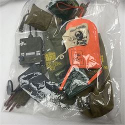 Action Man - large collection of 1960s and later figures and accessories including Spaceman with ATLRV vehicle; two figures marked 'Made in England by Palitoy under licence from Hasbro 1964'; twenty-five assorted weapons; radio backpacks; kit bags; twenty-one pairs of boots; football boots and snow shoes; metal diver's boots and three pairs of flippers; two pairs of jackboots; roller skates; various tunics, trousers, flying suits, jumpers, belts etc; twenty helmets, berets, busby, kepis, submariner etc; and quantity of other accessories