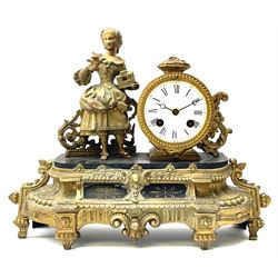 Late 19th century French gilt metal figural mantel clock, the circular enamel Roman dial beside figure of a girl holding a bird and cage, eight day movement by ‘Japy Freres’ striking the hours and half on bell, on black slate platform, ornate floral and cartouche moulded base