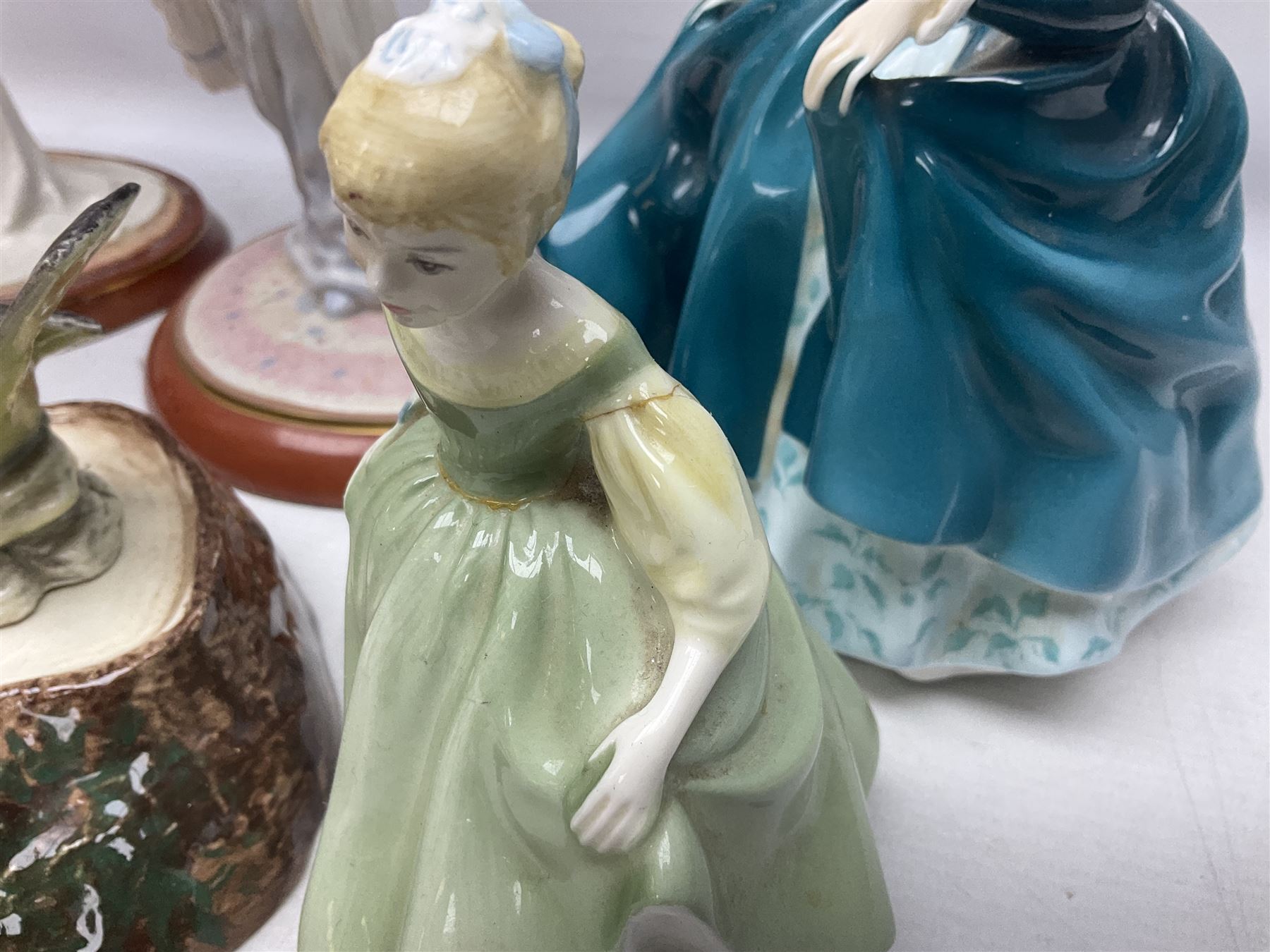 Nine Beswick bird figures, with stand, together with USSR thrush, two Franklin Mint Jane Austin figures and four Royal Doulton figures 