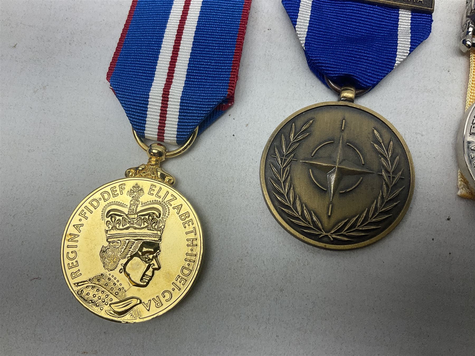 NATO Service Medal with clasp for Former Yugoslavia; together with three copy medals - Iraq Medal with clasp for 19 Mar to 28 Apr 2003 and unfitted rosette; Operational Service Medal with Afghanistan clasp; and QEII Golden Jubilee 2002 medal; all with ribbons (4)