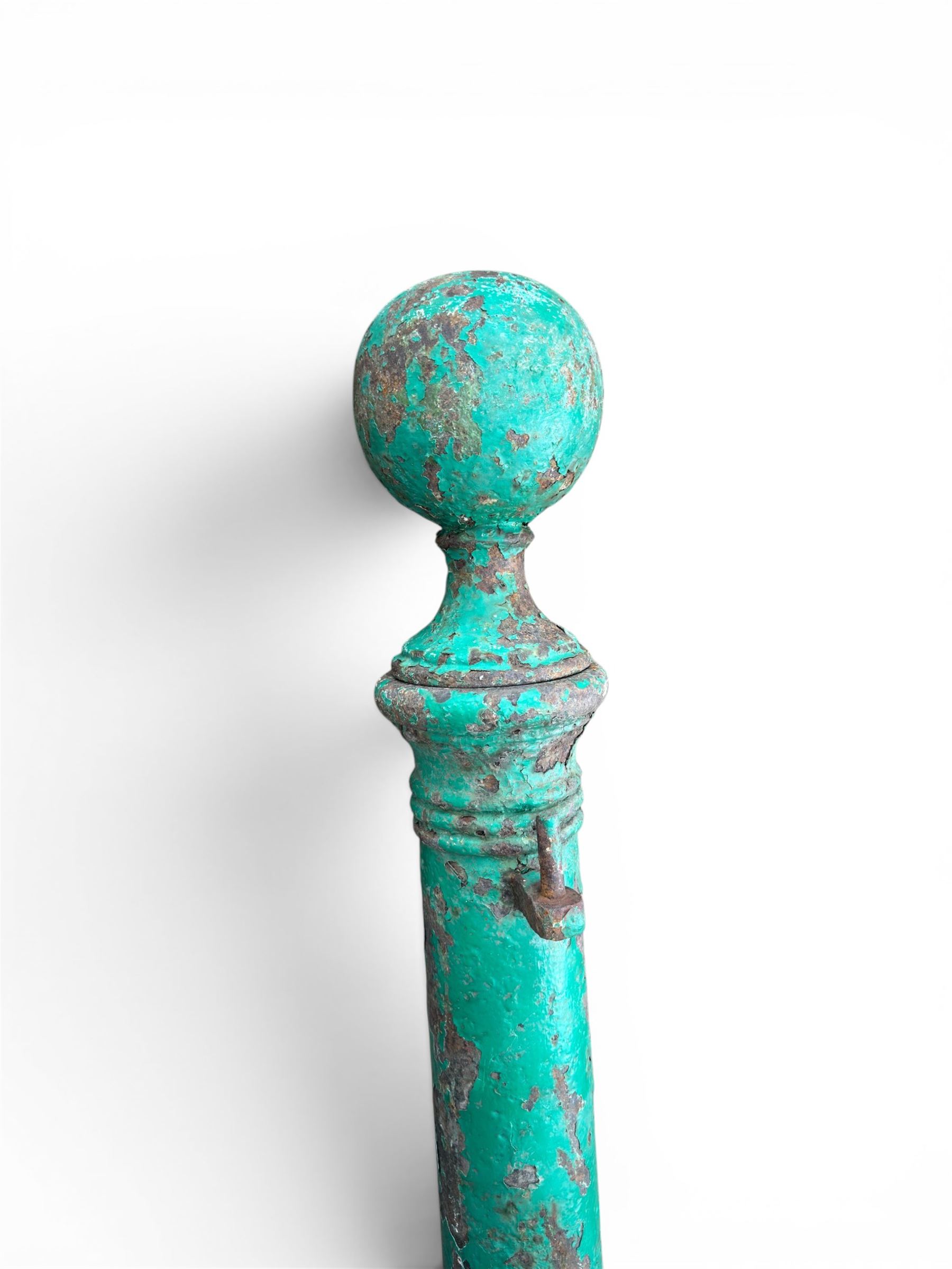 19th century circular cast iron gate post with finial, painted in distressed green finish