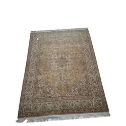 Fine Tabriz (300nspi) beige ground rug, central medallion with repeating border 