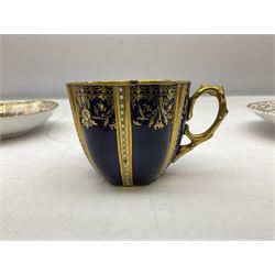 Early 20th century Meissen style teacup and saucer decorated with finely painted reserves of nautical scenes alternating with panels of gilt floral sprays on cobalt blue ground, with spurious blue crossed swords mark beneath, the cup with fully gilded interior, together with an 1830s Copeland & Garrett Felspar teacup and saucer, heavily decorated with painted panels of blue and pink flowers amongst foliage surrounded by ornate gilt pattern, pattern no. 4901, with stamped marks beneath, largest D15cm