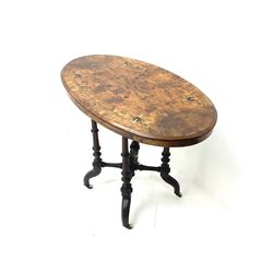 Victorian walnut occasional oval table, inlaid top, turned tapering supports, central finials, shaped legs and castors