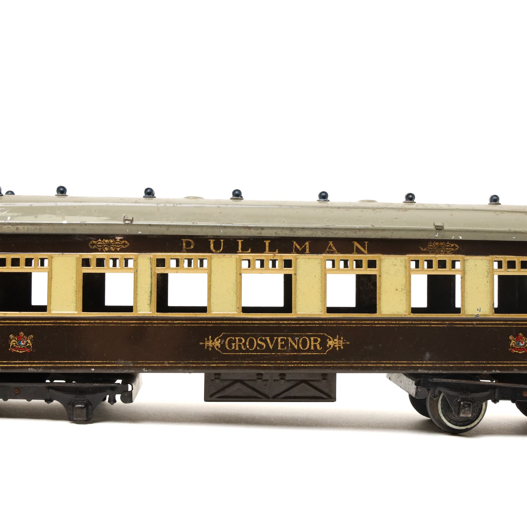 Hornby O gauge Parlour Car 'Grosvenor', a Hornby Pullman coach and a vintage Crumpsall biscuit tin in the form of a trunk