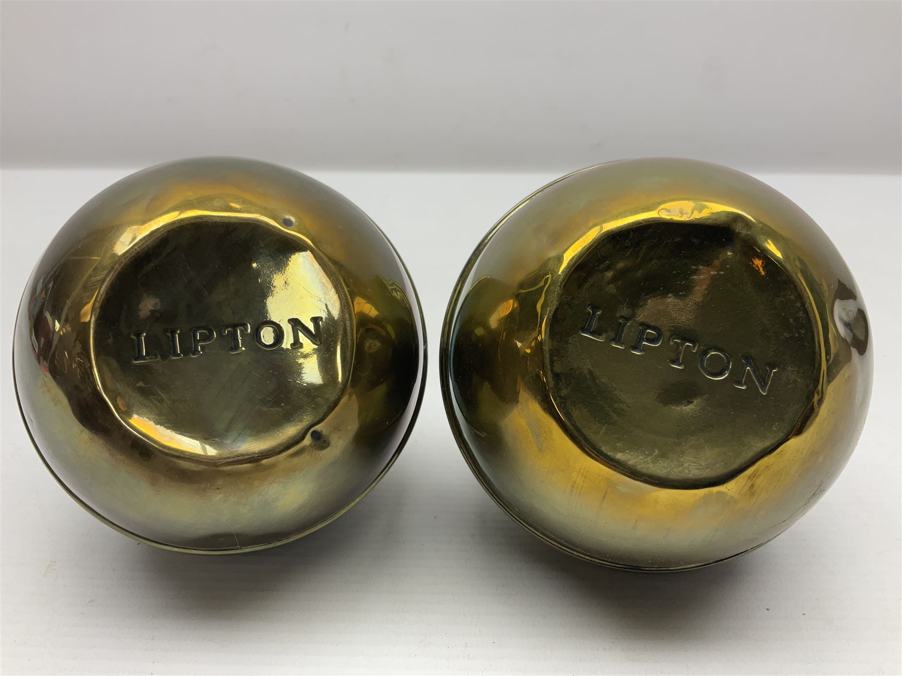 Pair of brass 1924 commemorative tea caddies, of ovoid form the waist embossed with 'British Empire Exhibition 1924' 'Lipton's Souvenir Tea Caddy', H18cm