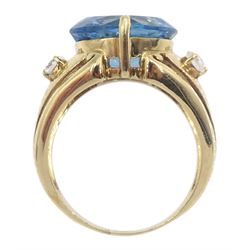 9ct gold single stone blue topaz dress ring, set with two white zircons either side, hallmarked