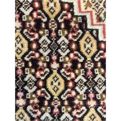 Small Persian Bidjar rug, the field decorated with floral Herati motifs, within floral design borders and guard stipes 