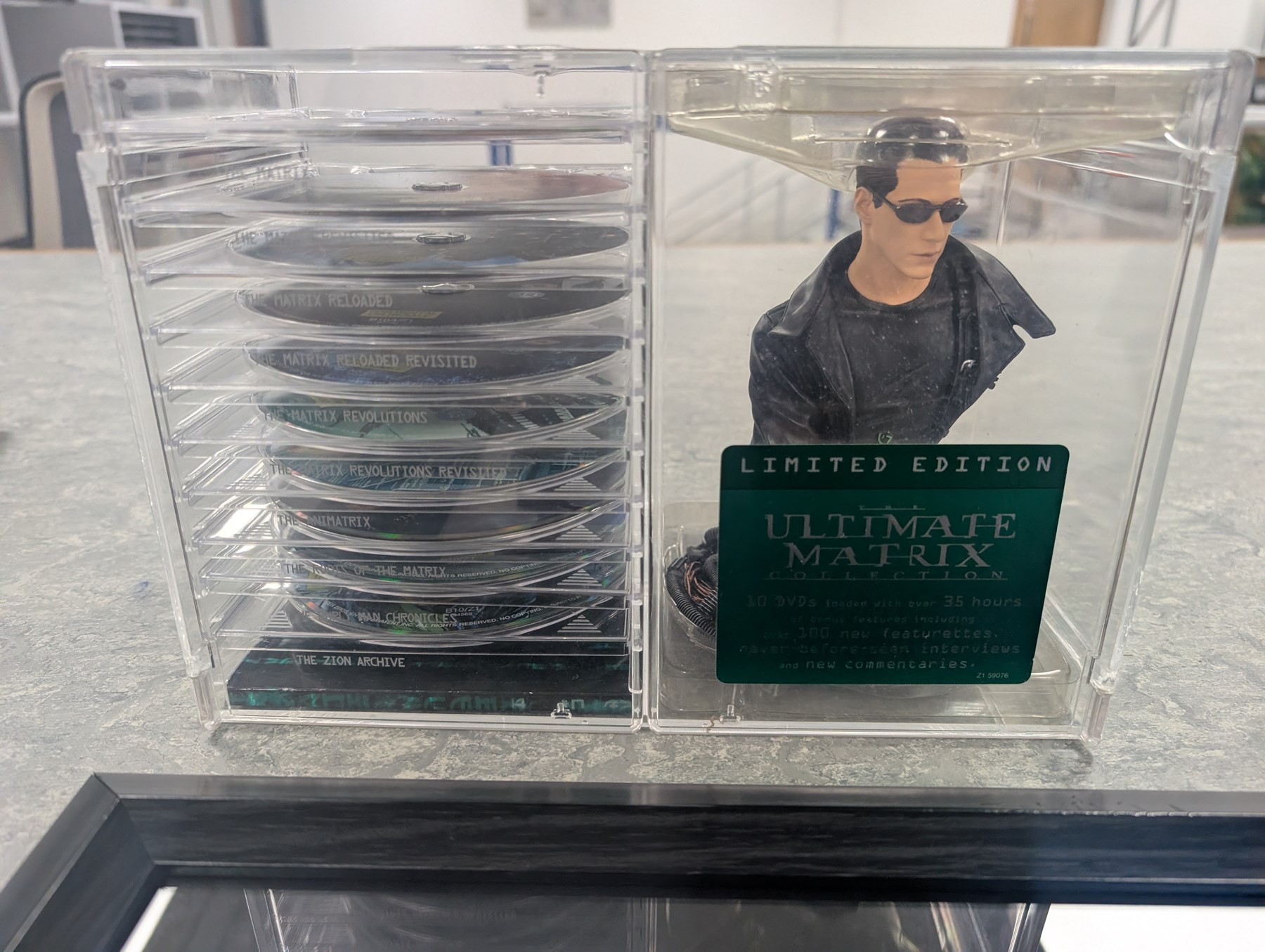 Signed The Matrix montage print with spurious signatures, together with framed Matrix prints and film cells and a limited edition ten DVD box set with bust