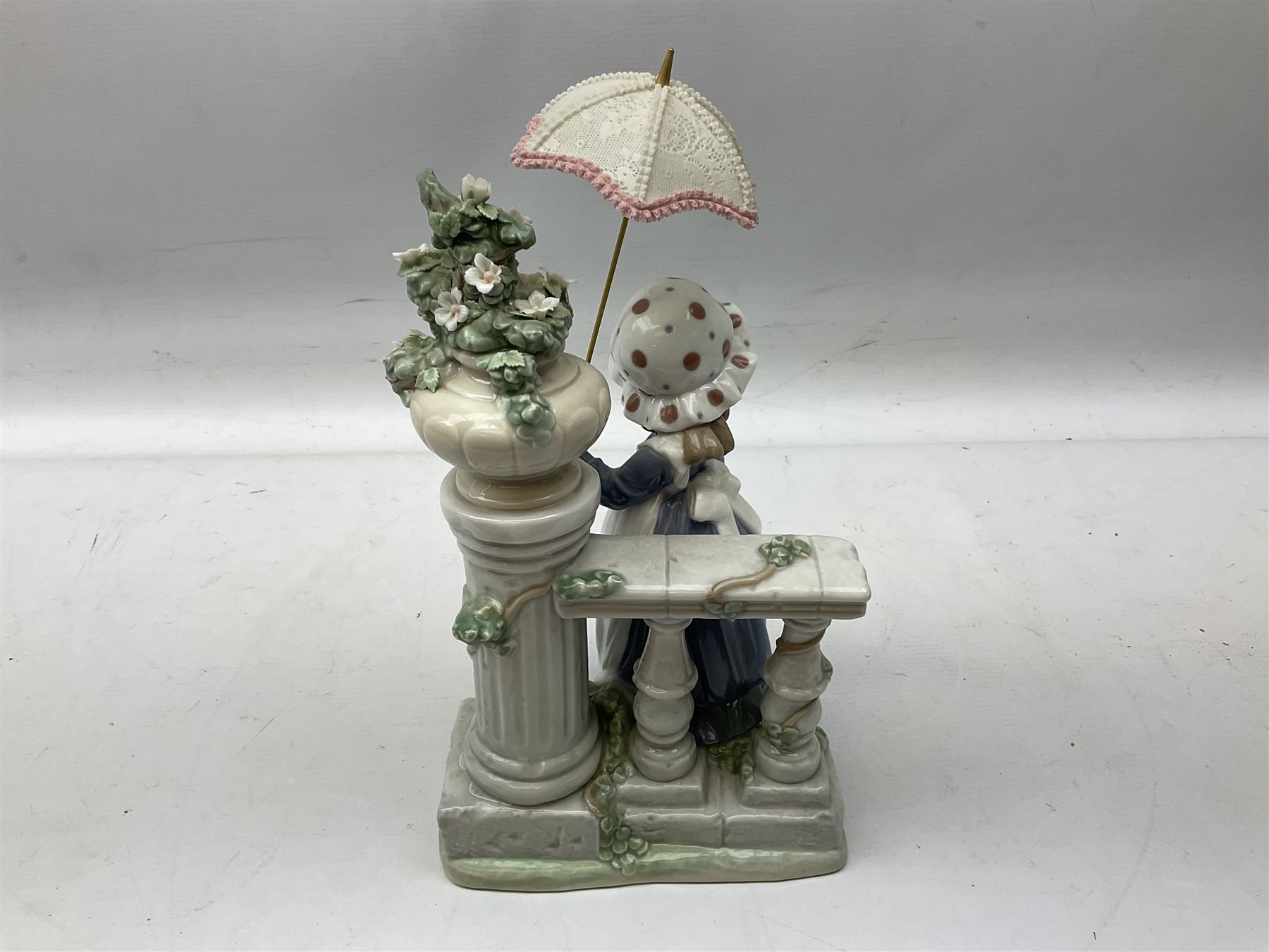 Lladro figure Glorious Spring, modelled as a girl holding a flower and parasol, no. 5284, H32cm