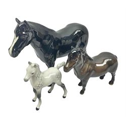 Three Beswick horses, comprising Beswick Dale pony Maisie 1671, Shetland pony 1033 and Arab grey foal 1407