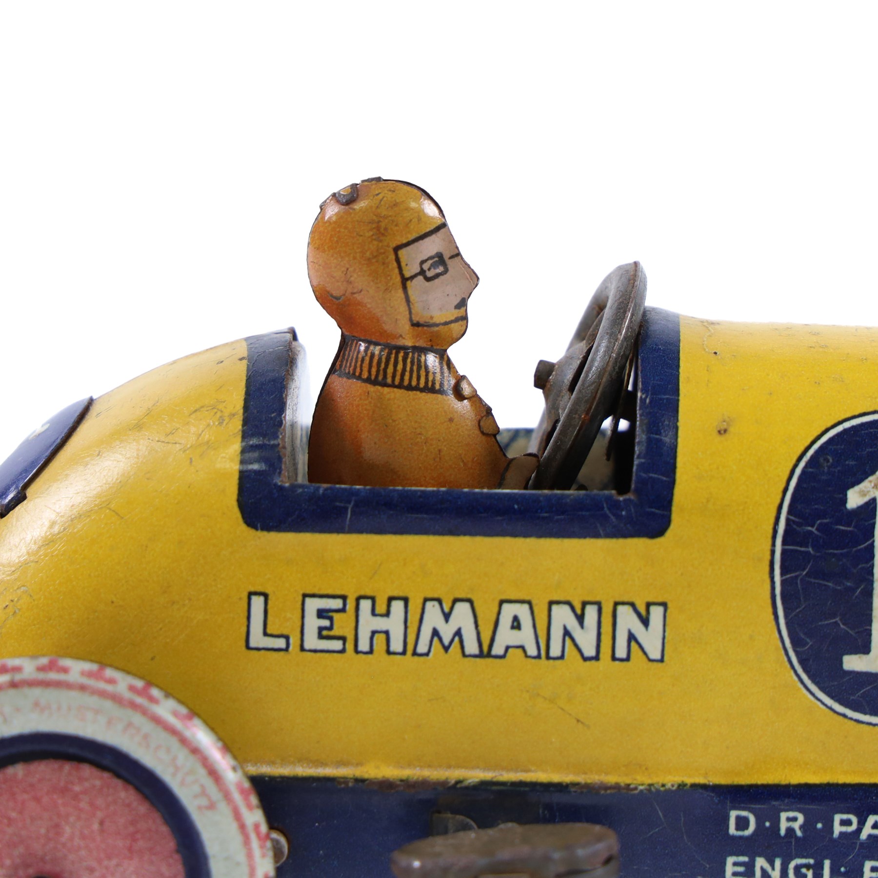 Early 20th century Lehmann tinplate clockwork 'Galop' no.760 racing car, yellow with blue stripes, driver and lithographed details, H6cm, L14cm