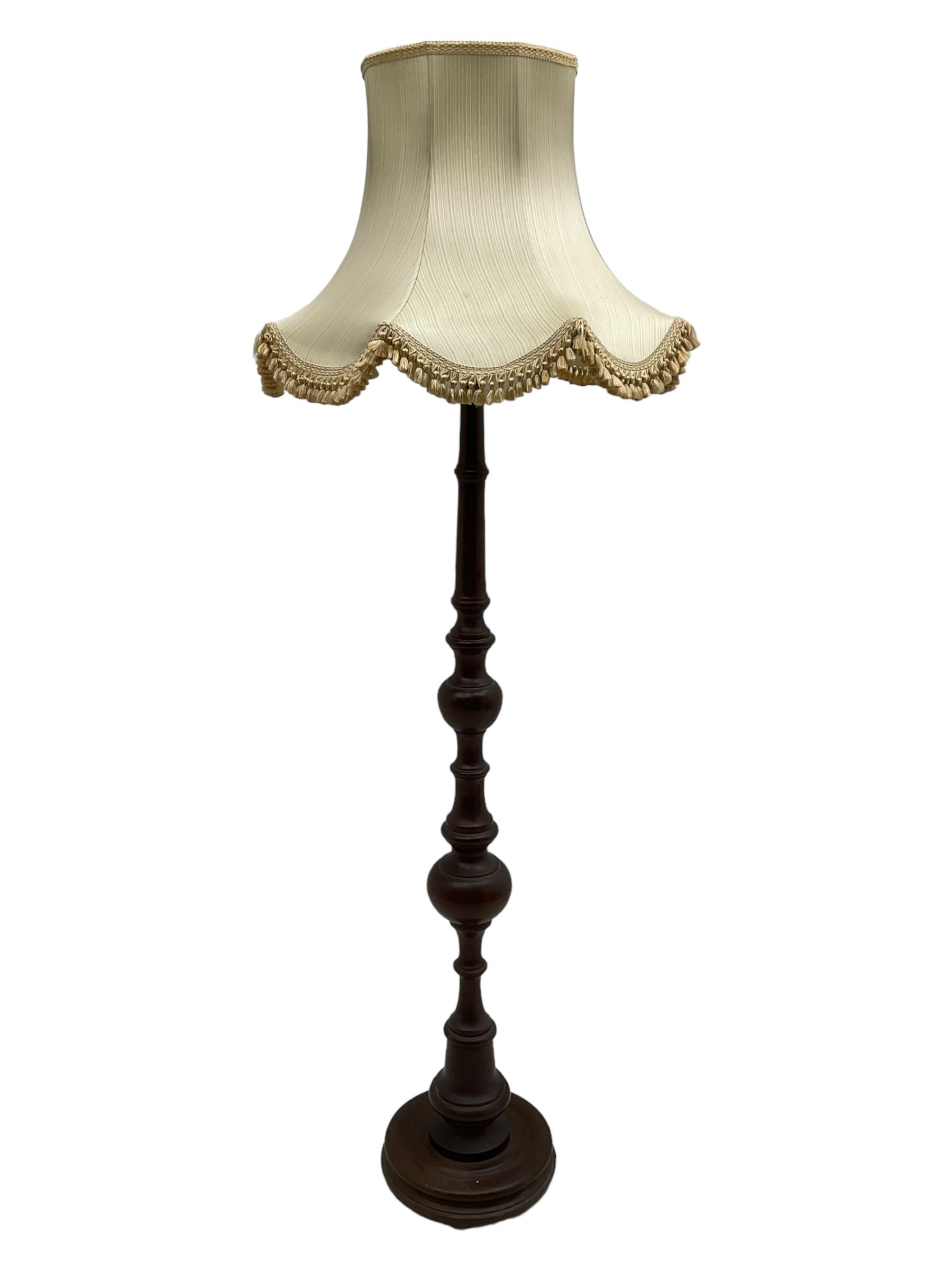 20th century walnut standard lamp, turned column on circular base, with shade 