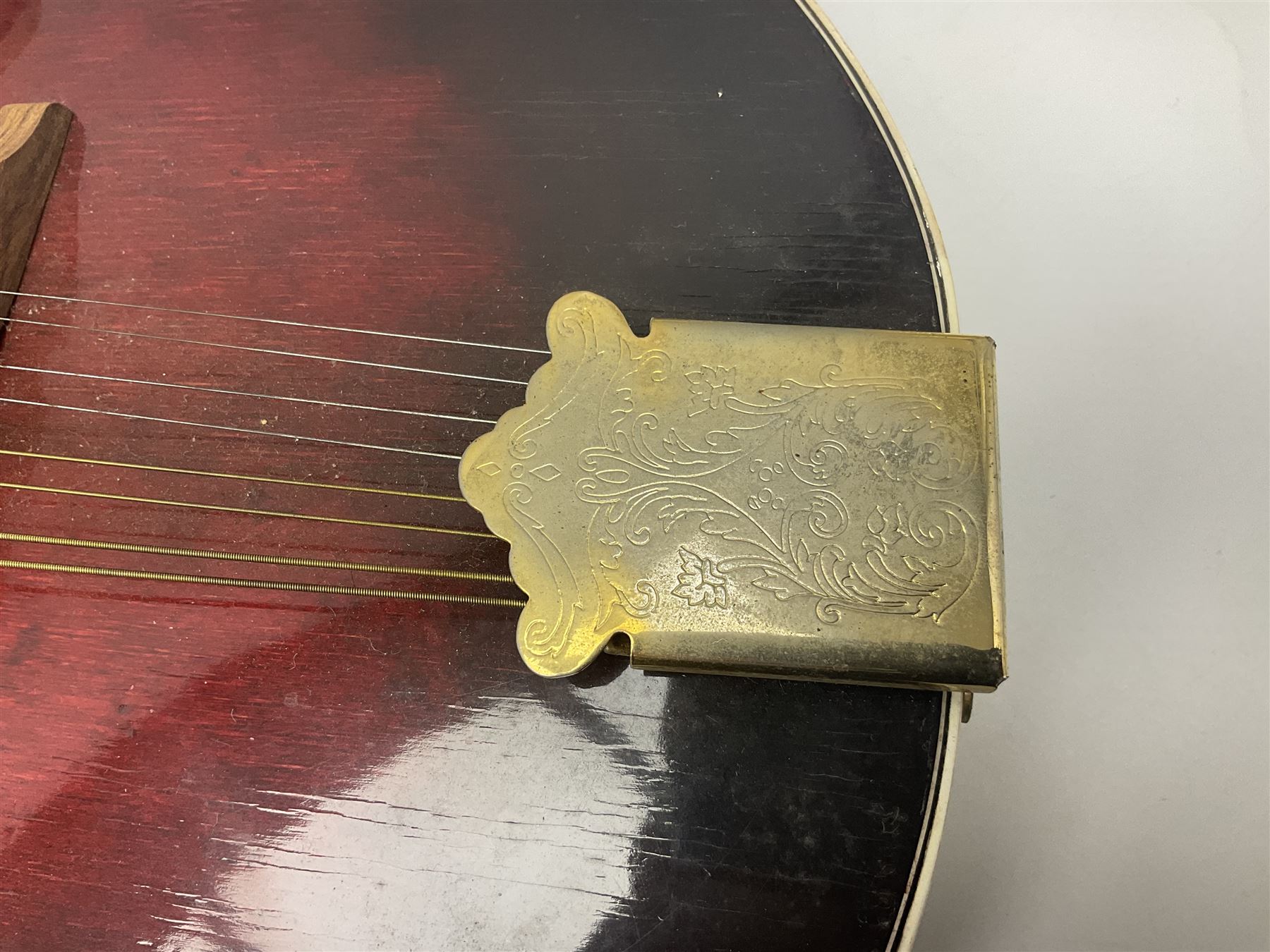 Eastern eight-string mandolin with sunburst finish and mother-of-pearl inlay L68.5cm; and another Harmony mandolin with cracked headstock (2)