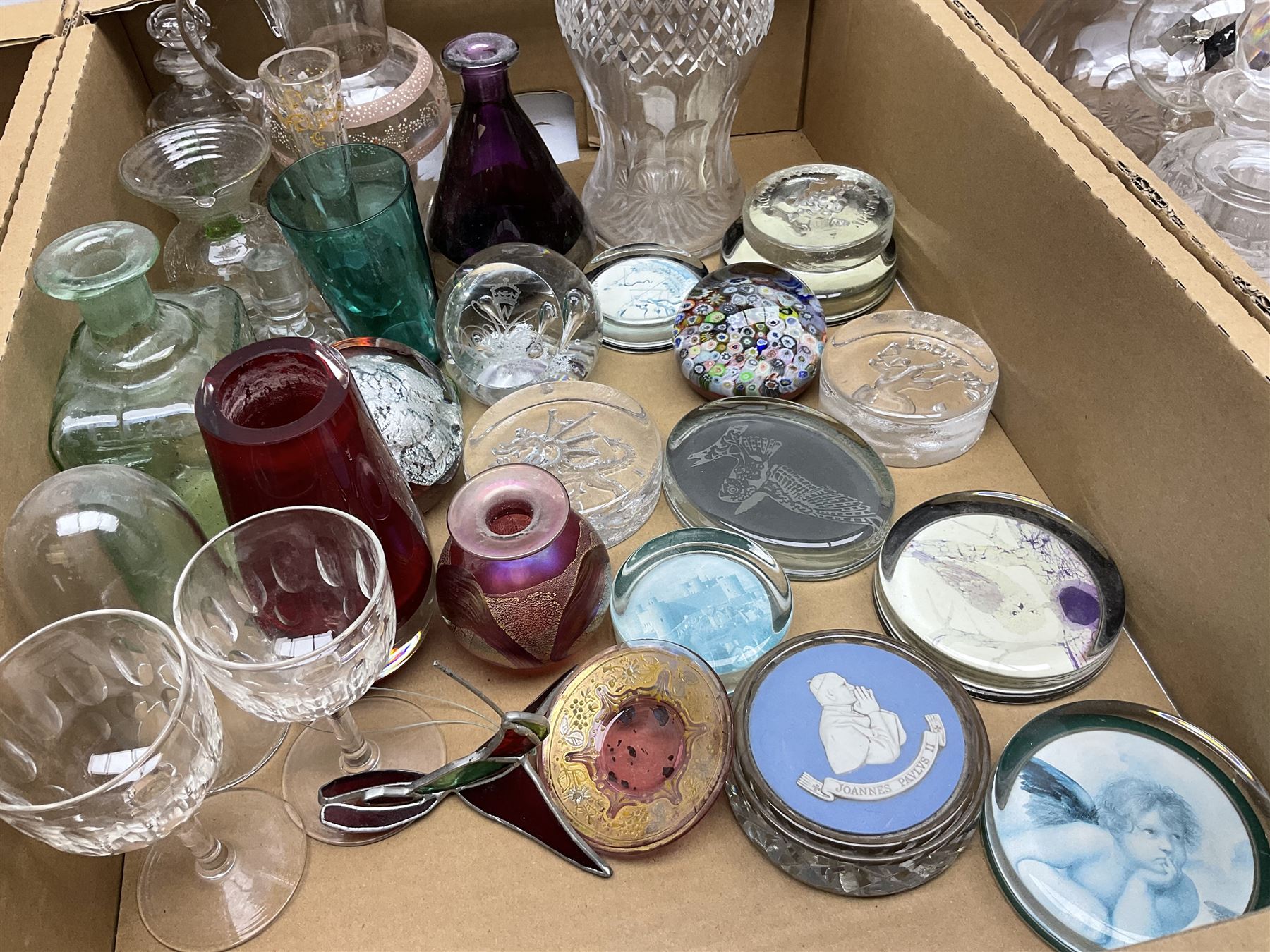 Millefiori paperweight, together with Caithness paperweight, Isle of Wight vase, cranberry glass tumblers, claret jug, decanters and other glassware, in three boxes 