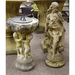  Two composite garden figure of a female H67cm, and a sundial on cherub support, H64cm (2)  