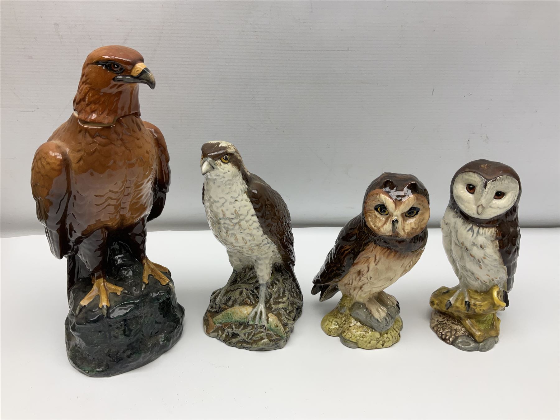 Collection of Beswick and Royal Doulton whisky decanters, in the form of birds, to include Golden Eagle, Barn Owl, Peregrine Falcon, Buzzard etc 