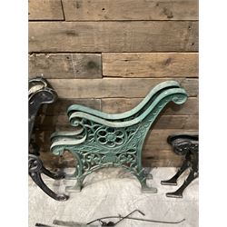 Four pairs of ornate cast iron bench ends (8)