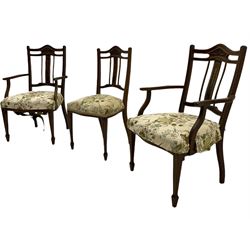 Set six Edwardian inlaid rosewood and mahogany salon chairs, the cresting rail carved with floral motif, the middle splat inlaid with bell flowers, sprung upholstered seats, square tapering supports with spade feet, two elbow chairs and four side chairs