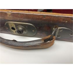 Leather shotgun case, the red baize lined interior with the trade labels of Westley Richards & Co., London, a brass plaque inscribed 'T Nevin, Mirfield, Yorkshire' to cover, with key, case to fit barrel 76cm (30 inches)  
