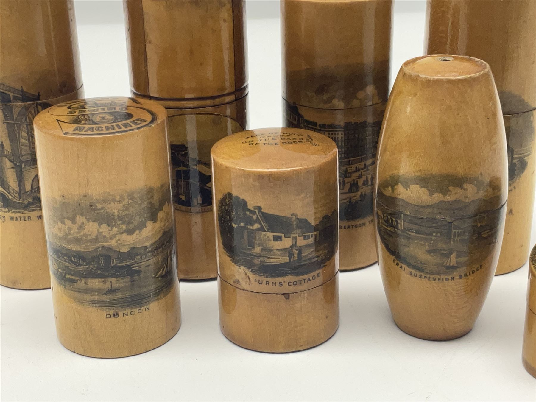 Collection of Mauchline ware relating to sewing, to include four ovoid shaped thimble cases, hinged lid thimble case and needle cases (12) 