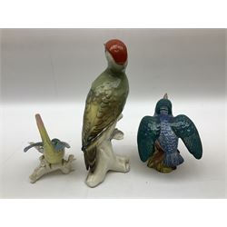 Karl Ens figure of a green woodpecker, modelled perched upon branch, model no. 7527, together with Karl Ens figure of budgie and Beswick Kingfisher no. 2371, all with printed marks beneath, tallest H25cm