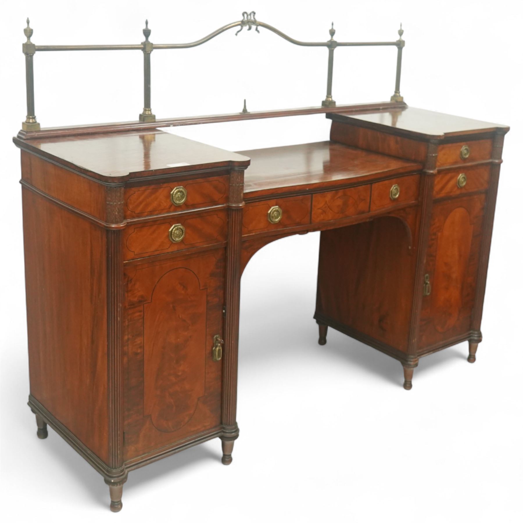 19th century mahogany Hepplewhite design pedestal sideboard or pair of bedside pedestals, each pedestal fitted with two drawers and cupboard, decorated with figured panelled doors and ebony stringing, curled leaf carved mounts over reeded half columns, on turned feet 