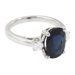 18ct white gold sapphire and diamond three stone ring, single oval cut sapphire of approx 3.00 carat, with a round brilliant cut diamond set either side, hallmarked, total diamond weight approx 0.25 carat