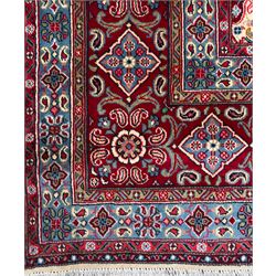 Northwestern Persian Hamadan carpet, hand-knotted, ivory field with an all-over Herati design of rosettes and serrated leaves within multiple borders, madder red with angular vine and rosette motifs, 375cm x 271cm 