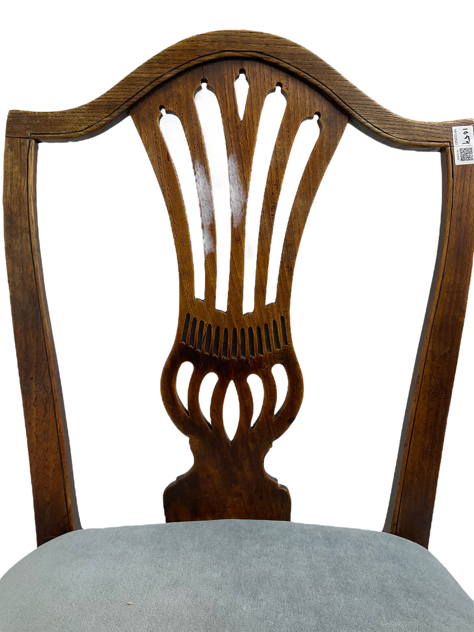 Early 19th century elm side chair, shaped cresting rail over vasiform splat with pierced decoration (W53cm, H96cm); Hepplewhite period mahogany side chair, shield back with pierced splat, on square tapering supports with spade feet (W55cm, H99cm); George III walnut elbow chair, shaped cresting rail and moulded frame, upholstered drop-in seat, on square supports with inner chamfer (W59cm, H95cm) (3)