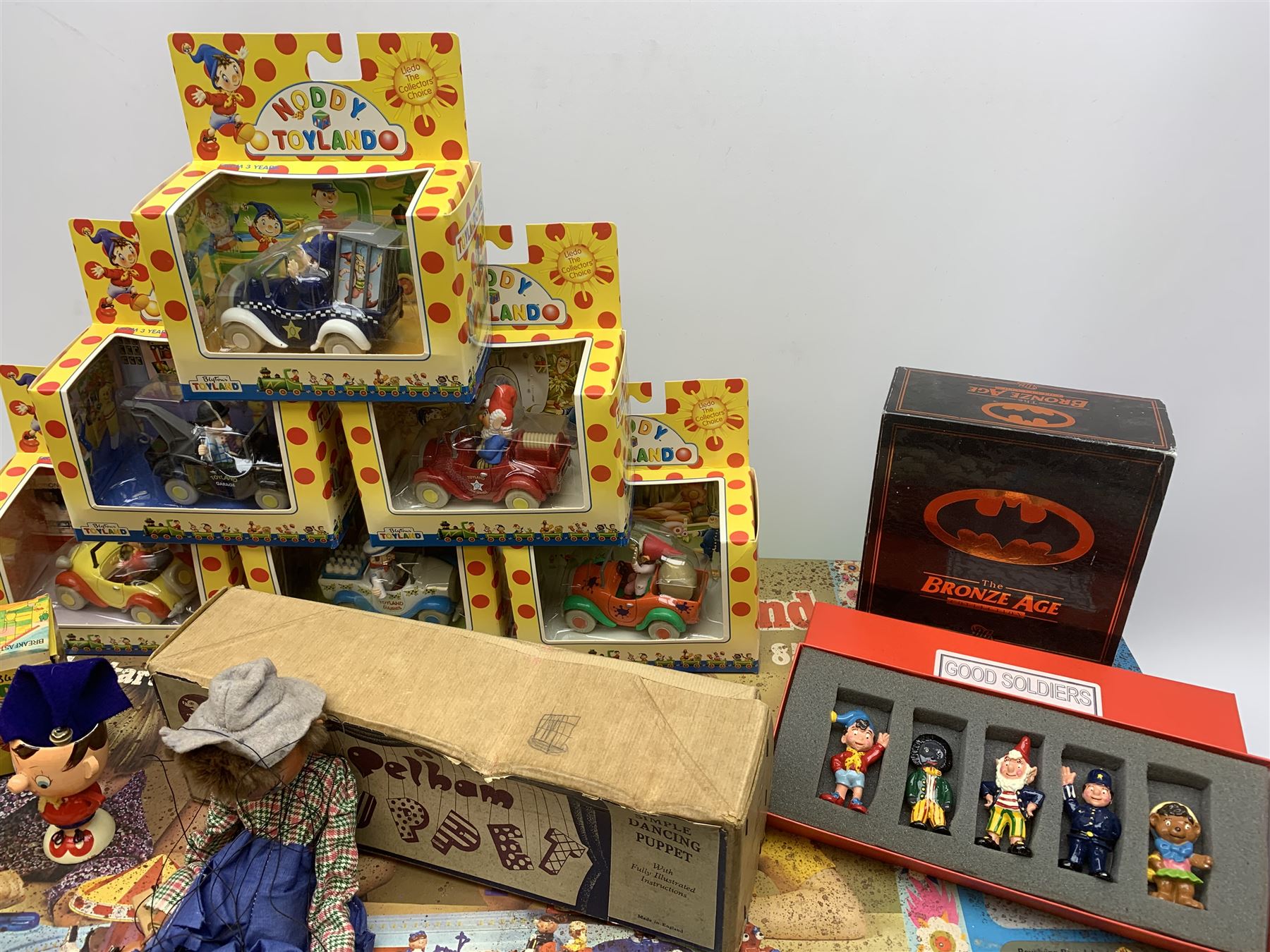 1970s Corgi Magic Roundabout Playground No.853; 1960s Bock Finland Pola600 table top football game; 1950s Pelham Puppet - Cowgirl; six Lledo Noddy in Toyland die-cast models; Good Soldiers set of five Noddy in Toyland cast metal figures; pair of Noddy and Big Ears painted wooden egg cups with hats; and DC Bronze Age Collection pair of Batmobiles; all boxed (13)