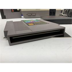 Nintendo Entertainment System (1985) console with two controllers, accessories and instruction booklet. NES Games ‘Duck Hunt’ with Nintendo Zapper gun, ‘Pinball’ and ‘Super Mario Bros.’, all with original sleeves and instruction booklets. NES game ‘Super Mario Bros. 2’ cartridge only