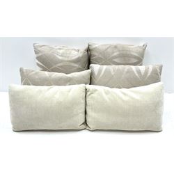 Grande four seat sofa upholstered in patterned fabric with contrasting scatter cushions 