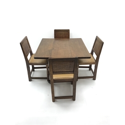  Mouseman square oak dining table on shaped cruciform  style base (W90cm, H71cm, D92cm) and four panelled back chairs, upholstered tan leather seat with stud detailing (W44cm) by Robert Thompson of Kilburn  