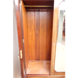  Edwardian mahogany triple wardrobe, projecting cornice, two doors flanking central bevel edge mirror with canted corners above two drawers on bracket supports, W174cm, H203cm, D61cm   