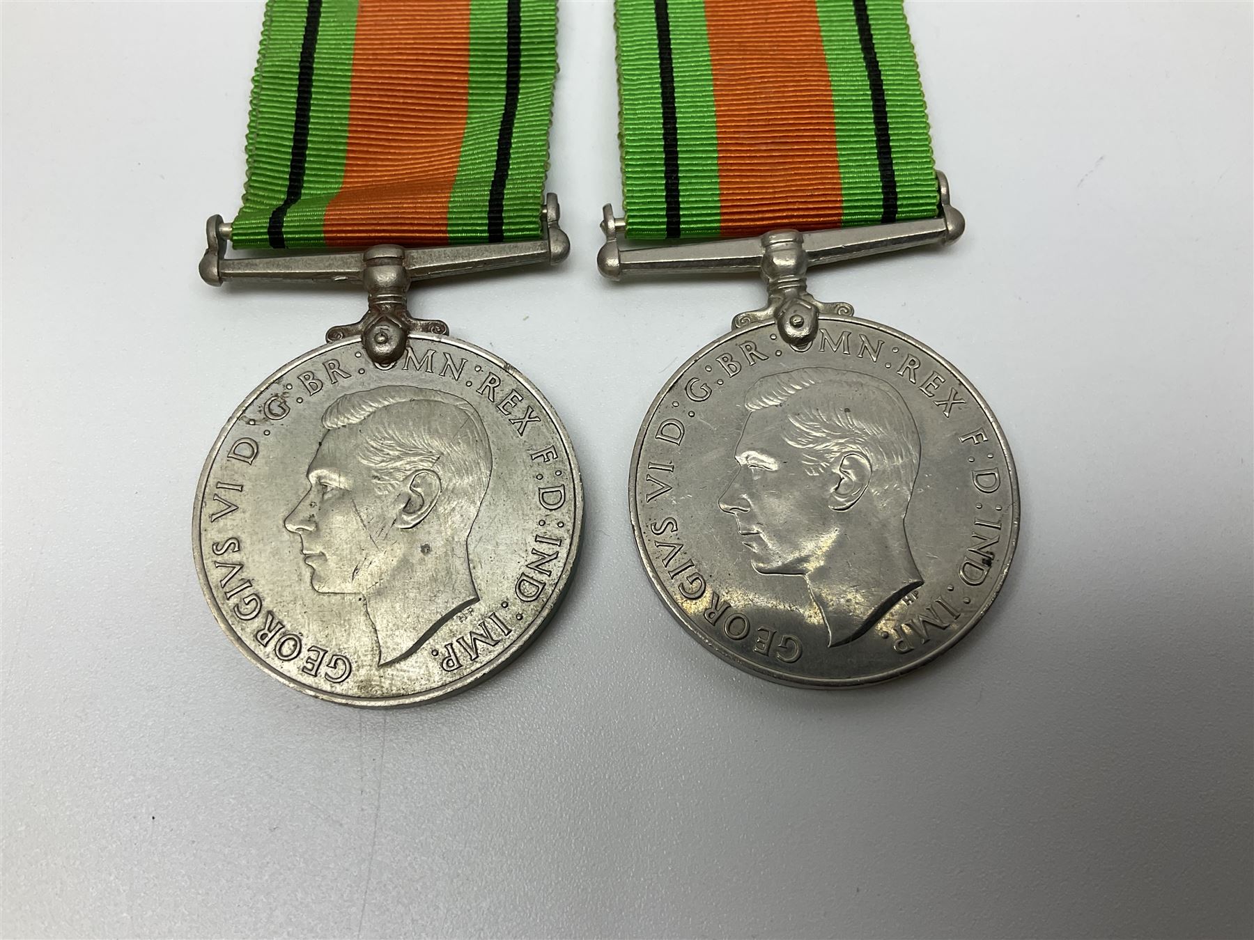 Eleven WW2 medals comprising three 1939-1945 war medals, two Defence medals, three 1939-1945 Stars, Atlantic Star, Africa Star and Italy Star; miniature QEII Naval LS & GC medal; all with ribbons; and WW2 postumous medal slip to Flight Sergeant L.N. Clark